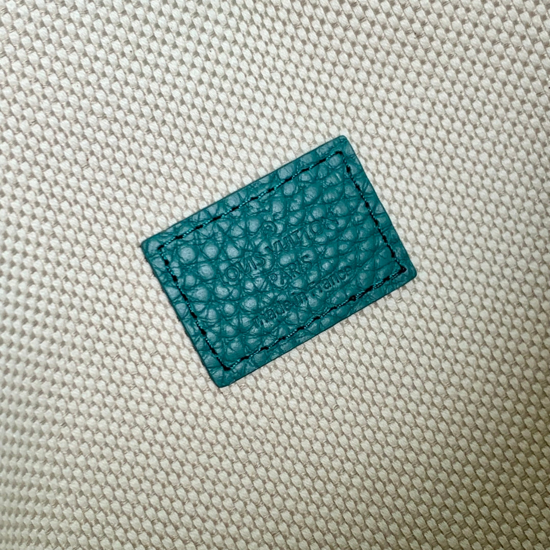 STEAMER WEARABLE WALLET 18 IN TEAL GREEN MONOGRAM TAURILLON CALFSKIN