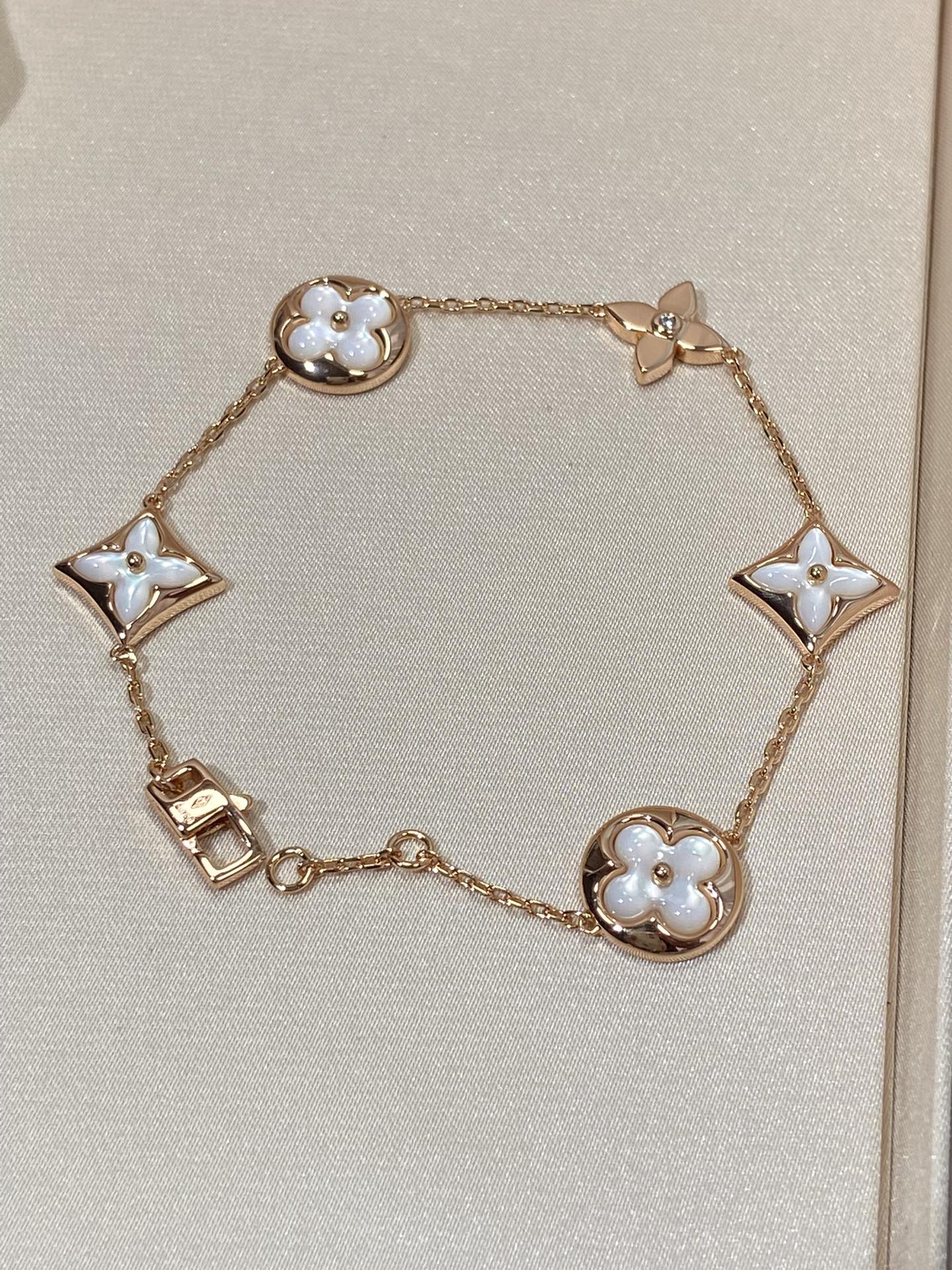 [AURORA]STAR AND SUN 5 MOTIF MOP PINK GOLD BRACELET