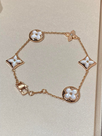 [AURORA]STAR AND SUN 5 MOTIF MOP PINK GOLD BRACELET