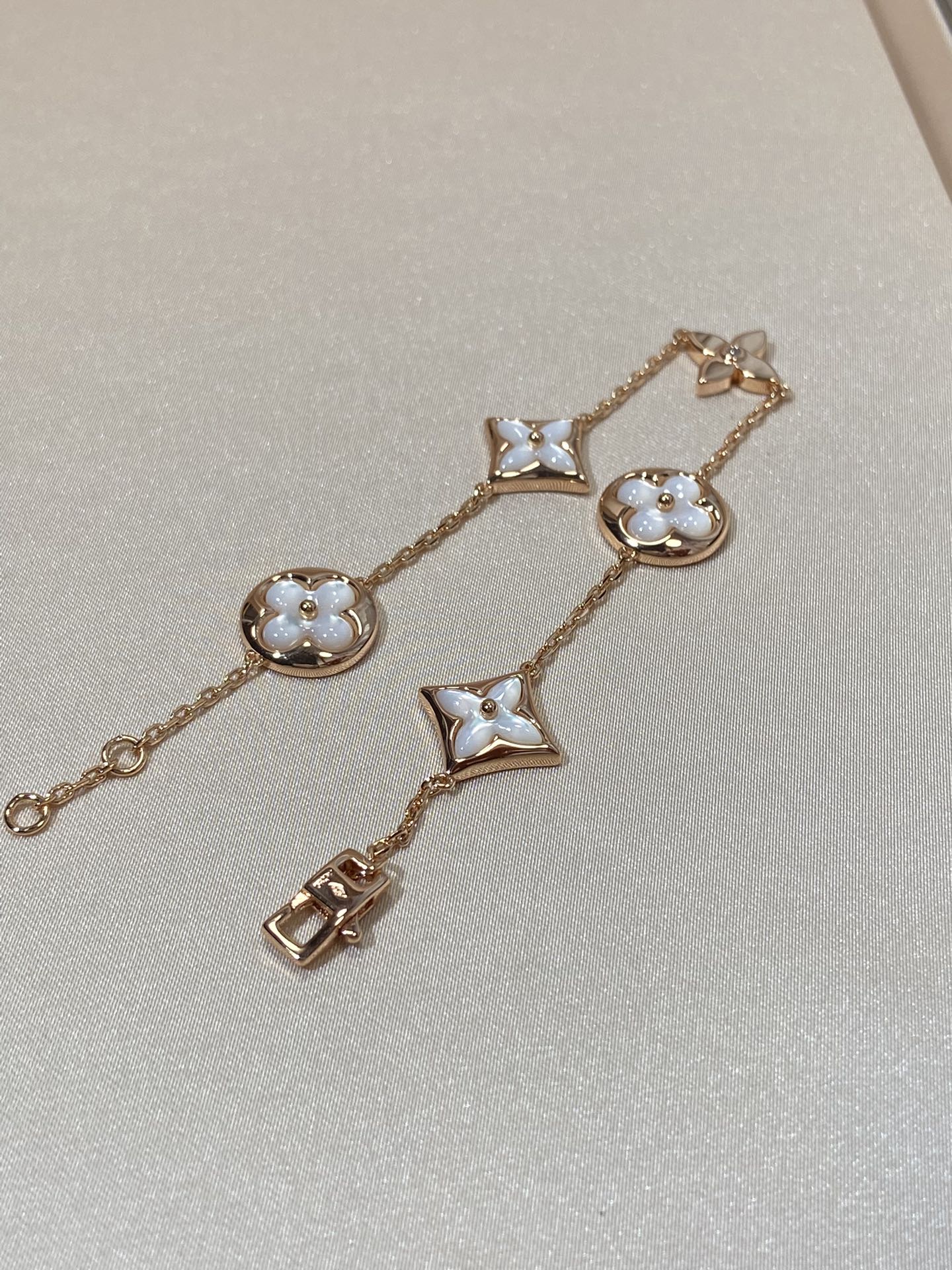 [AURORA]STAR AND SUN 5 MOTIF MOP PINK GOLD BRACELET
