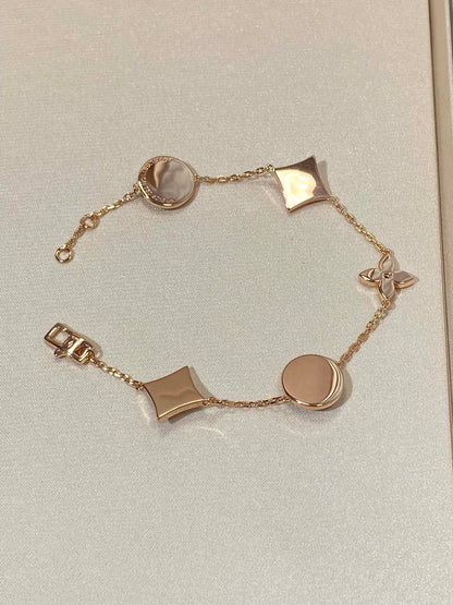 [AURORA]STAR AND SUN 5 MOTIF MOP PINK GOLD BRACELET