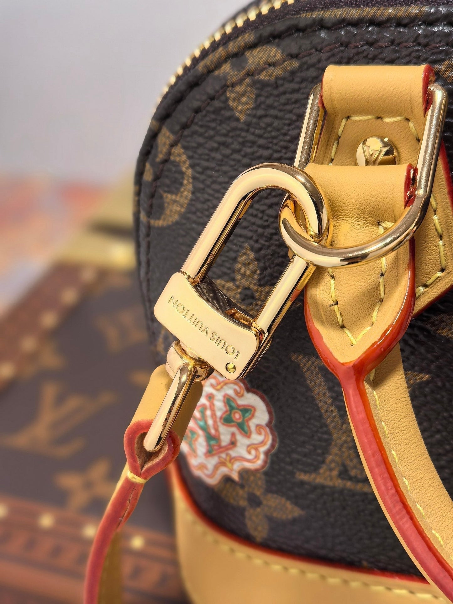 LV 25S NANO ALMA 18 IN BROWN MONOGRAM CANVAS PRINTED WITH THE VIVIENNE MASCOT