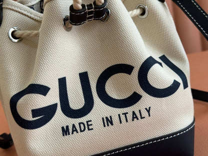 SMALL DRAWSTRING SHOULDER BAG 21 IN WHITE CANVAS DARK BLUE CALFSKIN