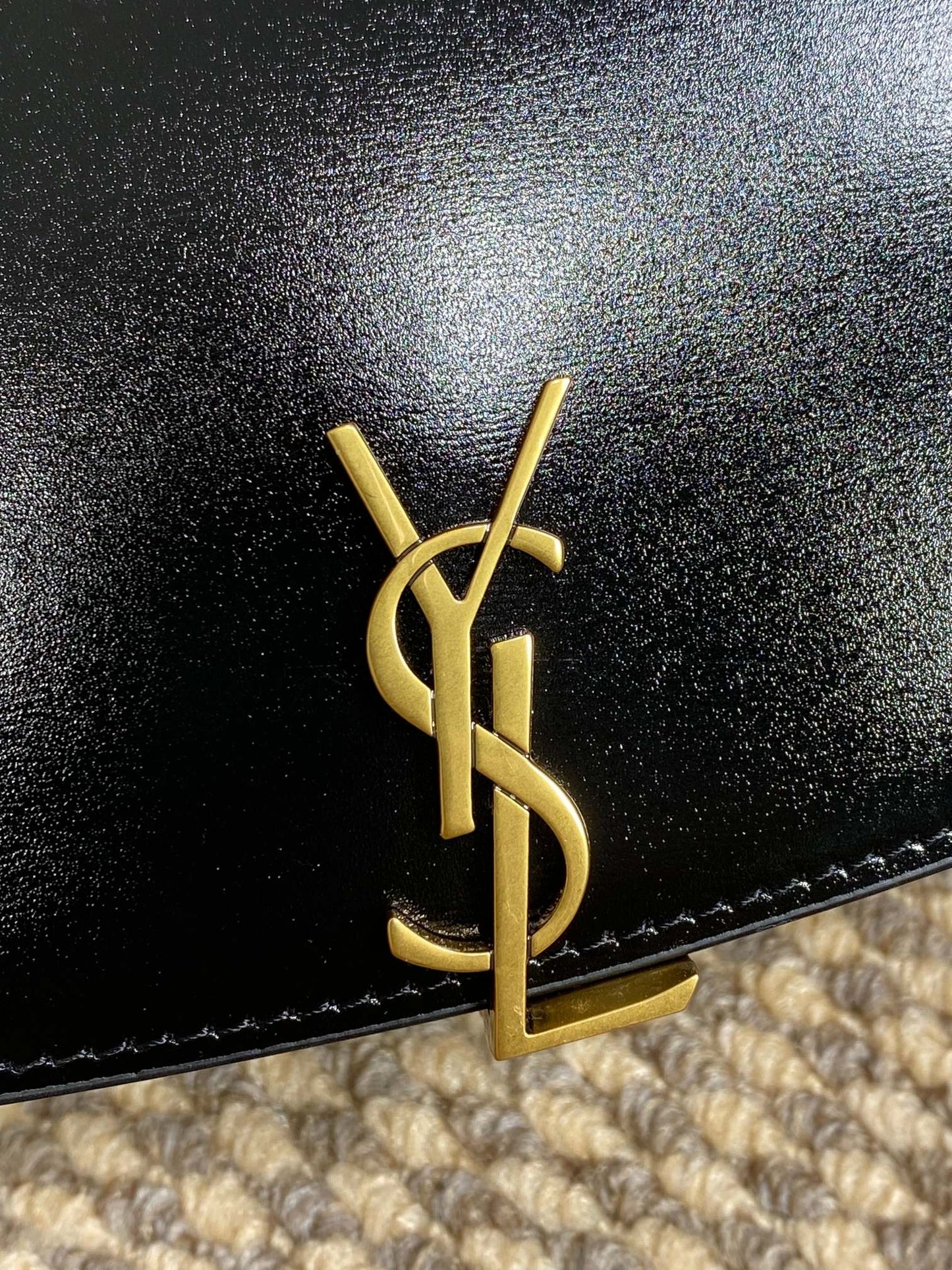 VOLTAIRE HALF-MOON SHOULDER BAG 24 IN BLACK CALFSKIN GOLD METALLIC